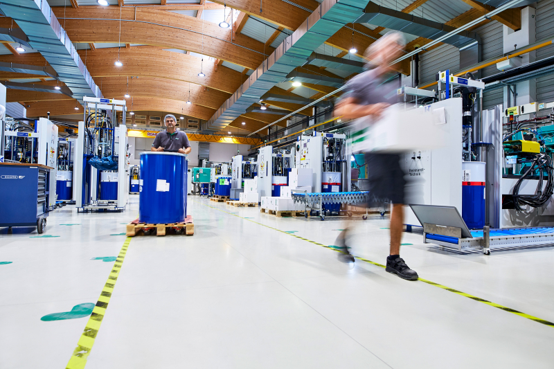 Man walks quickly through the production
